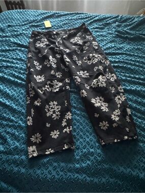 NWT Black barrel jeans with floral detail.